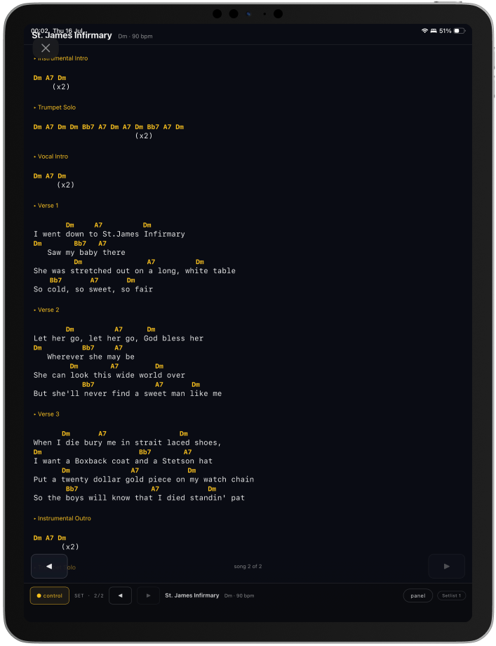 An iPad in portrait showing a song's lyrics with chords above them and previous and next song controls